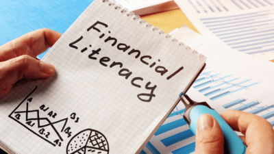 Notepad with Financial Literacy written on paper