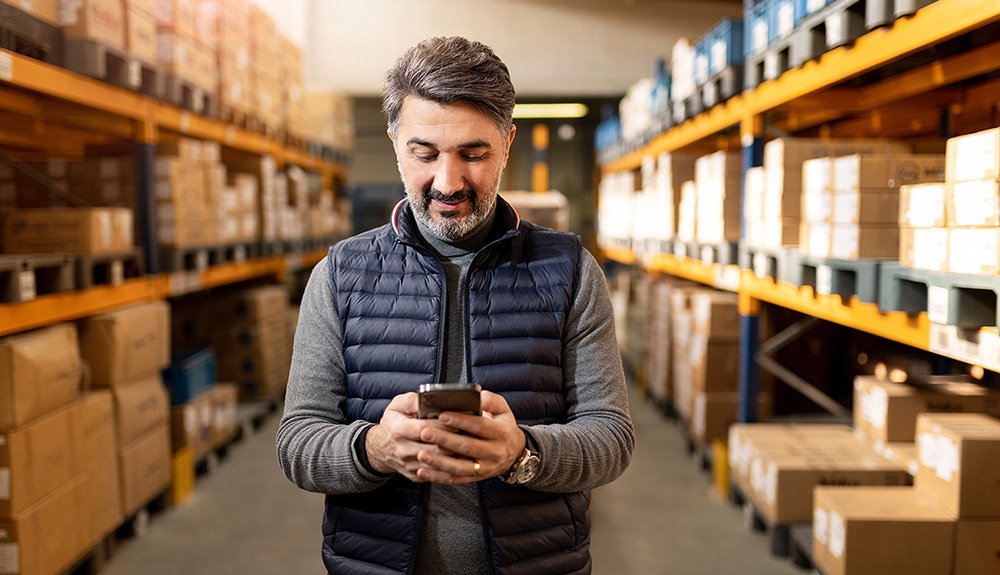 Business Owner looking at cell phone