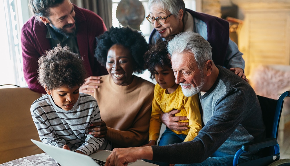 Multi-Generational family members looking at computer